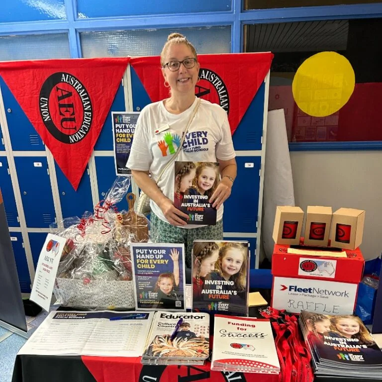 Rachael at AEU event booth in Australia.