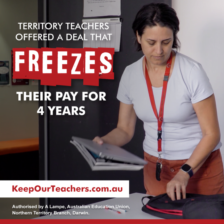 Teacher reviewing documents, campaign for fair pay.