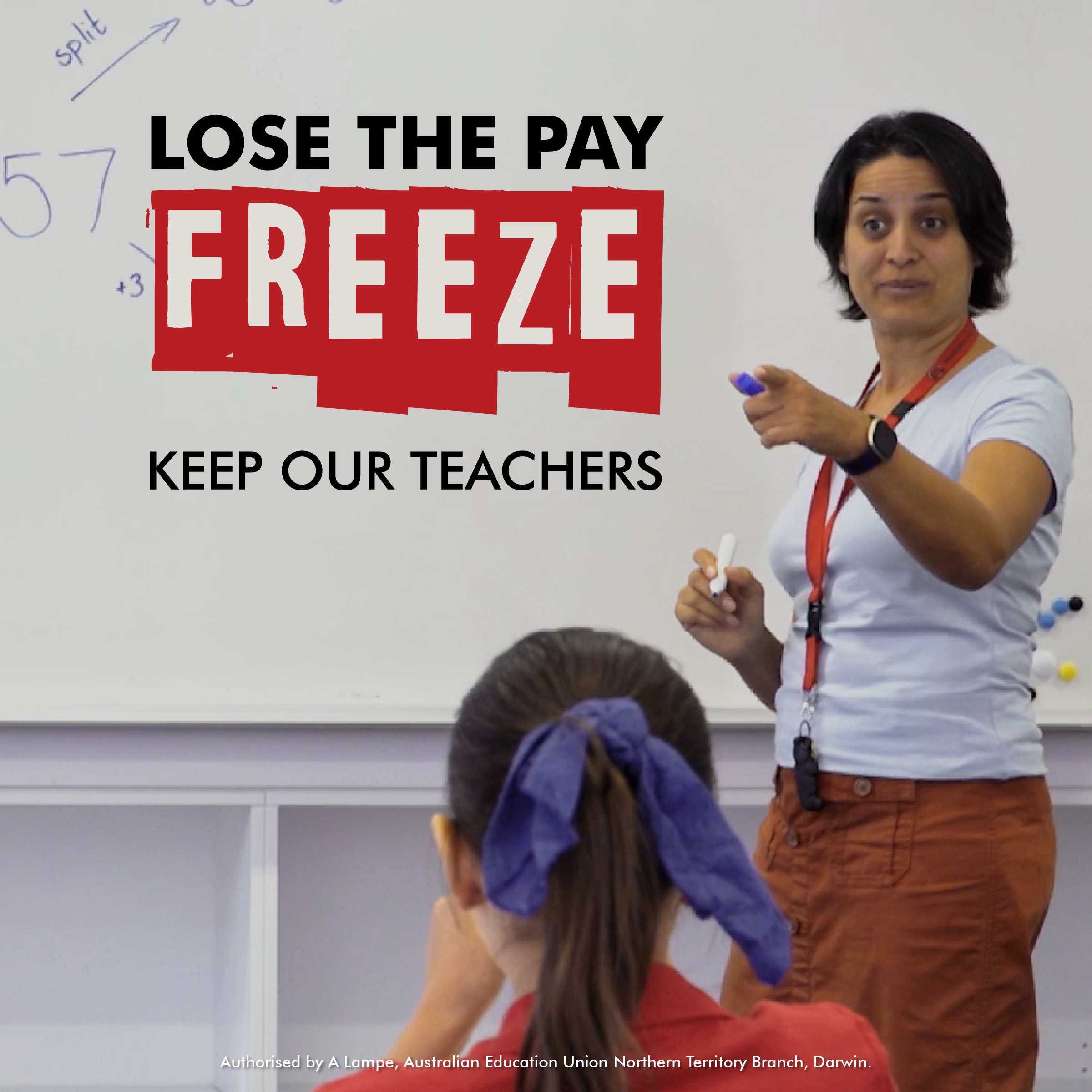 Teacher addressing class, education pay freeze protest poster.