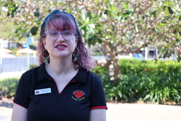 Woman with glasses outdoors in Australia.