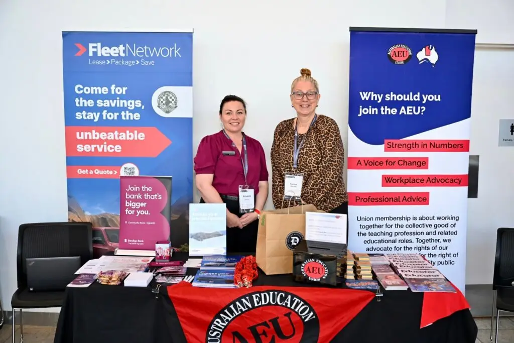 AEU representatives at an information stall with promotional materials